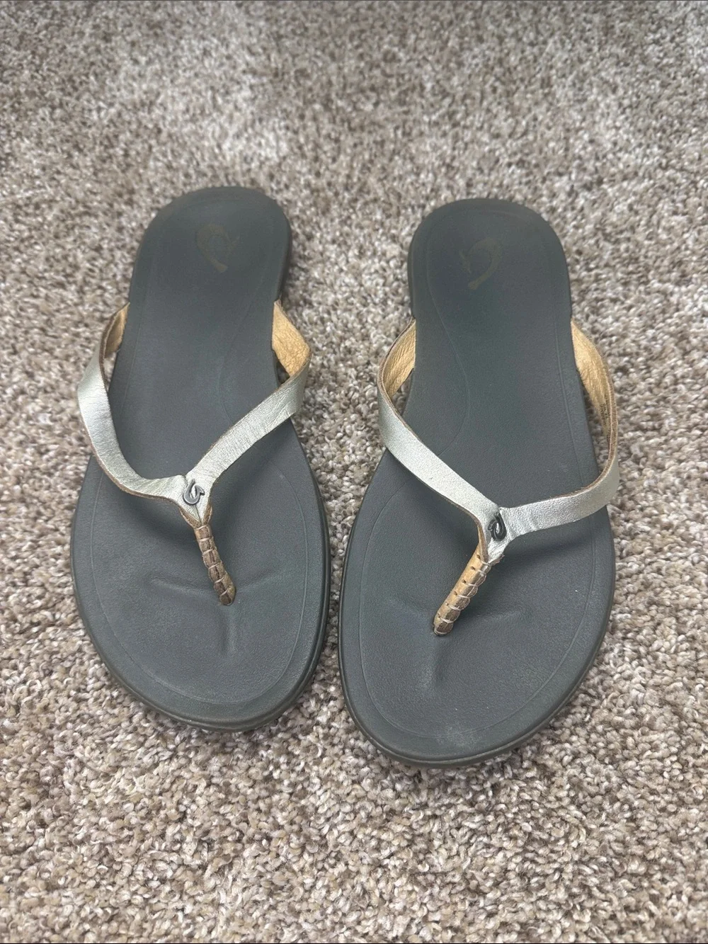 OluKai Gold and Black Women's Toe-Post Sandals
